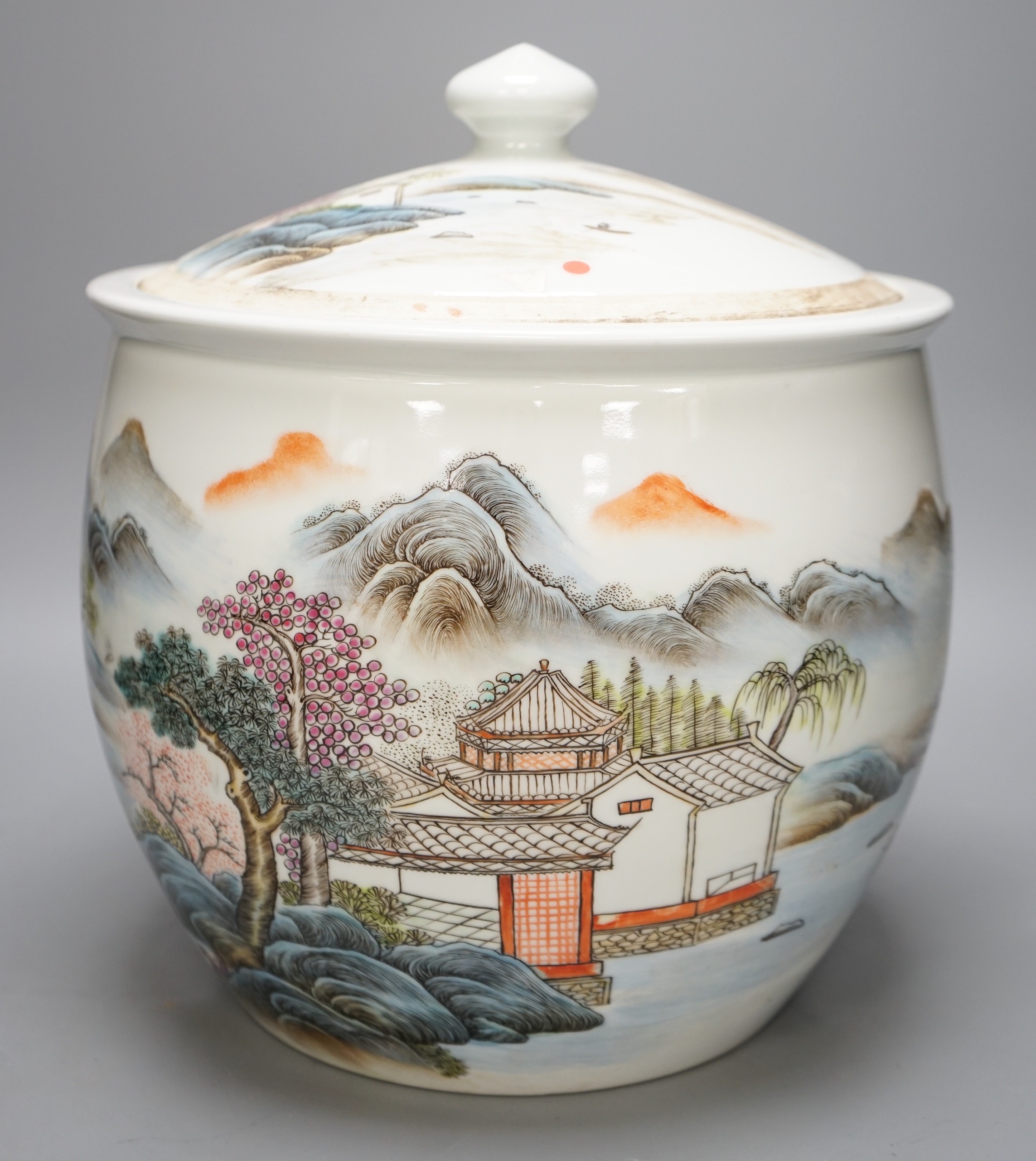 A large Chinese famille rose bowl and cover with mountainous landscape, 34cm tall